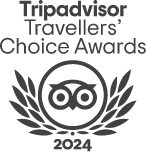 Logo dei Premi Travellers' Choice di Tripadvisor 2024 con gufi e foglie stilizzate.